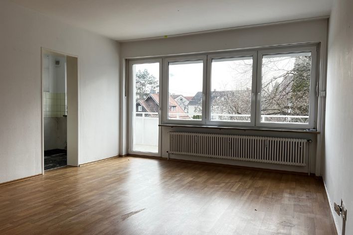 Sanierungsbedürftig! Kompakte DG-Wohnung mit TG-Einzelstellplatz!