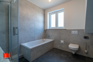 Daylight bathroom with tub and shower