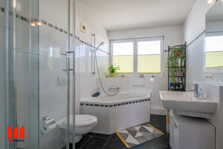 Bathroom with shower and tub on the first floor